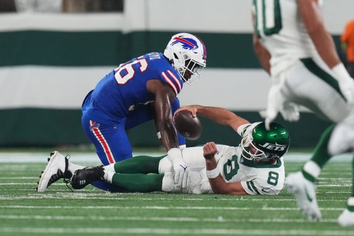 Jets' QB Aaron Rodgers (8) on the ground after being sacked by Leonard Floyd